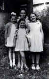 на дне рождения у Медеи, перед ней - её младшая сестра, а девочку слева не помню как зовут.